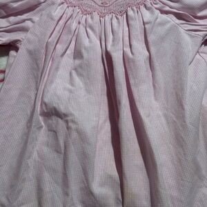 Smocked summer dress with embroidered boats, made of cotton and polyester.